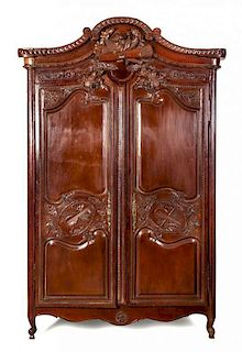 A Louis XVI Provincial Style Armoire Height 96 1/2 x width 61 1/2 x depth 28 inches.