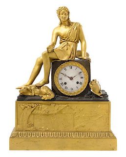 An Empire Gilt and Patinated Bronze Mantel Clock Height 16 1/4 inches.