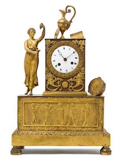* An Empire Gilt Bronze Mantel Clock Height 15 1/2 inches.