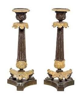 * A Pair of Louis Philippe Gilt and Patinated Bronze Candlesticks / 500 A Pair of Louis Philippe Gilt and Patinated Bronze Candl