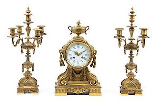 A French Gilt Bronze Clock Garniture Height of candelabra 18 5/8 inches.