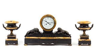 * A French Bronze Mounted Marble Clock Garniture Height of clock 14 inches.