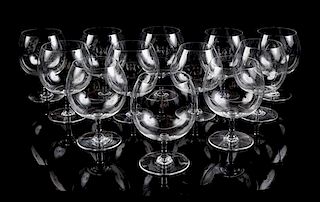 A Set of Twelve Baccarat Brandy Snifters Height 5 3/8 inches.