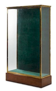 A French Brass and Glass Shop Vitrine Height 71 x width 16 1/4 x depth 42 1/2 inches.