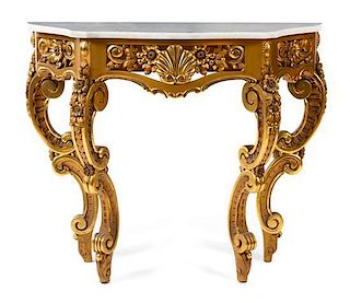 An Italian Baroque Style Giltwood Console Table Height 35 x width 43 1/2 x depth 16 1/2 inches.