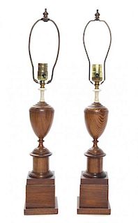 * A Pair of English Turned Oak Urns Height overall 25 inches.