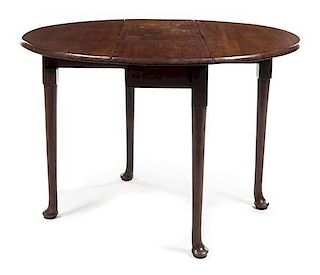 A Queen Anne Mahogany Drop-Leaf Table Height 28 x width 36 x depth 13 3/4 inches (closed).