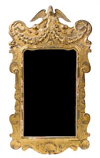 * A George II Style Giltwood Mirror Height 53 x width 27 1/2 inches.