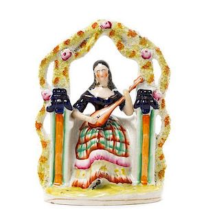 * A Staffordshire Figural Group Height 9 1/2 inches.