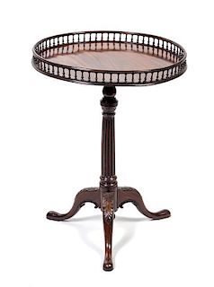 * A George III Mahogany Tea Table Height 30 1/2 x diameter 22 1/2 inches.