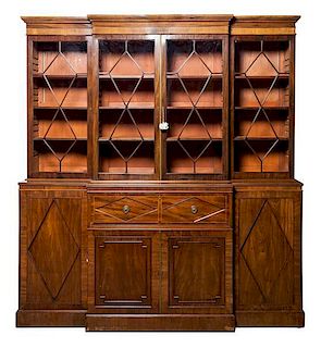 A Regency Style Mahogany Breakfront Bookcase Width 81 1/2 inches.