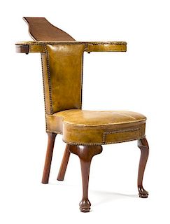 An Edwardian Mahogany Reading Chair Height 32 x width 29 1/2 x depth 20 1/2 inches.