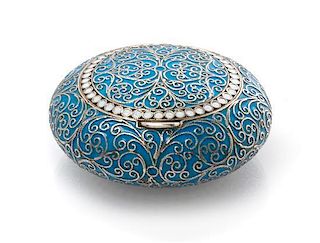 * A Russian Enameled Silver Snuff Box, Maker's mark GK, Moscow, late 19th/early 20th century, of circular form, having a light b