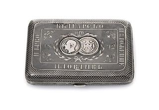* A Russian Niello Silver Cigarette Case, Late 19th century, the lid centered with two Bulgarian silver lev coins beneath a coro
