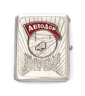 * A Russian Silver and Enamel Cigarette Case, Maker's mark AO, of rectangular form, the lid centered by an applied roundel decor