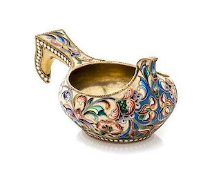 * A Russian Enameled Silver Kovsh, Maker's mark obscured, Moscow, late 19th/early 20th century, the case having a beige ground w