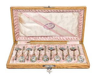 * A Set of Twelve Russian Enameled Silver-Gilt Spoons, Mark of Vasiliy Agafonov, Moscow, late 19th/early 20th century, each havi