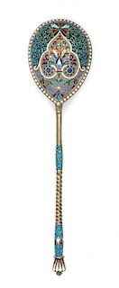 * A Russian Enameled Silver Spoon, , the back of the bowl worked with polychrome rinceau scrolls against a matted silver ground