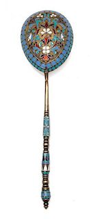 * A Russian Enameled Silver Spoon, , the back of the bowl worked with polychrome rinceau scrolls against a textured ground with