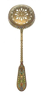 * A Russian Silver-Gilt and Enamel Tea Strainer, Maker's mark Cyrillic HKh, having a twist handle and a polychrome enameled term