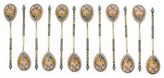 * A Set of Twelve Russian Silver-Gilt and Enamel Spoons, Mark of Ivan Saltykov, Moscow, Late 19th century, each having a twist h