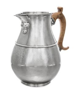 A George I Britannia Silver Pitcher, John Elston, Exeter, 1717, of baluster form with worked with a band to the body of the pitc