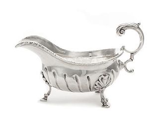 * A George II Silver Sauce Boat, Robert Innes, London, 1756, with a gadrooned rim and an applied S-scroll handle, the body with