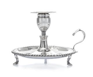 * A George III Silver Chamberstick, Robert Gerrard I, London, 1808, of typical form with a gadrooned rim, raised on S-scroll fee