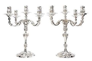 A Pair of Elizabeth II Silver Five-Light Candelabra, Garrard & Co. Ltd., London, 1969, the candle cups of baluster form with roc