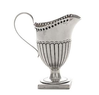 * A Victorian Silver Creamer, Hilliard & Thomason, Birmingham, 1892, the lower half of the body ribbed, raised on a square foot.