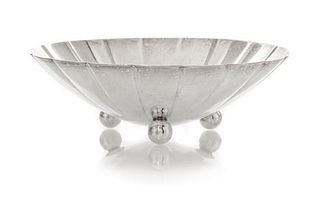 * An American Silver Small Bowl, Tiffany & Co., New York, NY, 1940, circular with scalloped sides, raised on three ball feet, en
