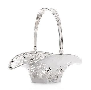 * An American Silver Fruit Basket, Grogan Company, Pittsburgh, PA, with a swing handle, pierced sides and engraved foliate scrol