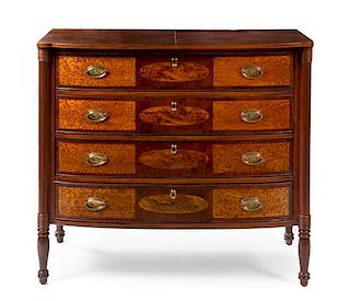 An American Mahogany and Bird's Eye Maple Bow Front Chest of Drawers Height 38 x width 43 x depth 22 1/4 inches.