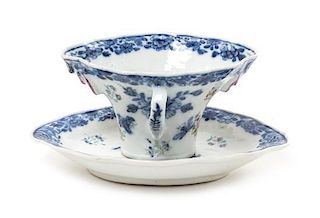 A Chinese Export Blue and White Porcelain Rhyton Cup and Underplate Width of saucer 6 3/4 inches.