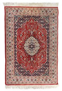 A Persian Wool Rug 6 feet 1 1/5 inches x 4 feet 1 1/2 inches.