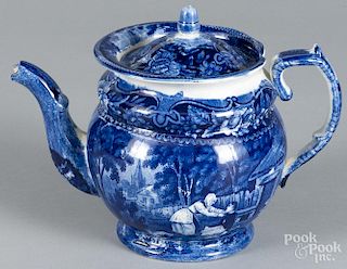 Blue Staffordshire teapot, 19th c., with an unknown scene of a woman leaning over a gentleman
