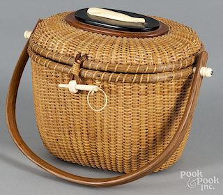 Nantucket basket purse, signed Farnum, 7 1/2'' h., 11'' w.