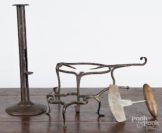 Wrought iron trivet, 19th c., with scrolled legs, together with another trivet, a steel food chopper