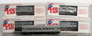 Four Lionel BUDD train cars, O gauge, with their original boxes, together with a 400 passenger car