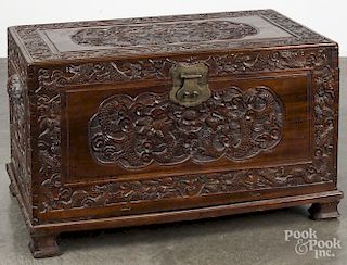 Chinese carved camphorwood blanket chest on frame, 24'' h., 39'' w.