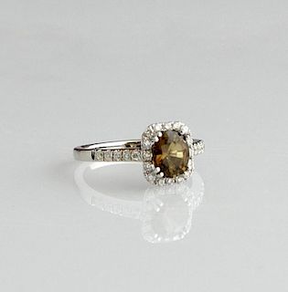 Lady's 18K White Gold Dinner Ring, with an oval 1.
