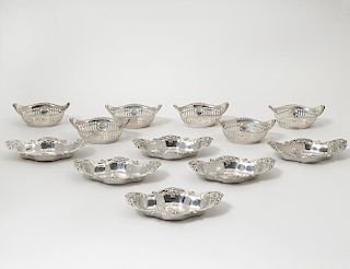 TWO SETS OF SIX STERLING SILVER NUT DISHES
