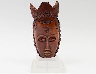 LACQUERED IVORY MASK OF A FEMALE