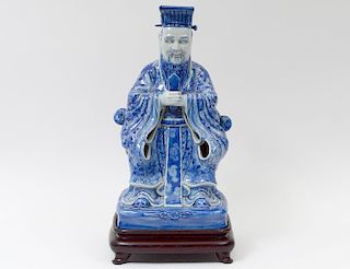 BLUE AND WHITE PORCELAIN FIGURE OF AN EMPEROR