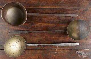 Wrought iron long handled utensils, 19th c., to include a brass skimmer, dippers, ladles, and forks.