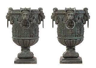 * A Pair of Gothic Style Patinated Cast Iron Urns Height 33 inches.