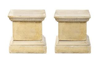 * A Pair of Cast Stone Pedestals Height 20 inches.