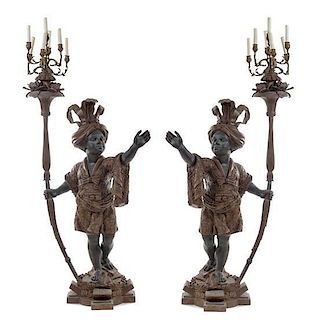 * A Pair of Venetian Baroque Style Cast Metal Figural Torcheres Height 72 inches.