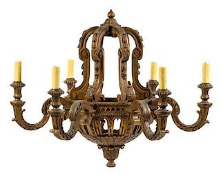 * A Baroque Style Giltwood Six-Light Chandelier Height 32 x diameter 36 inches.