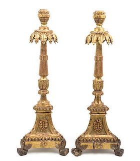 * A Pair of Italian Neoclassical Giltwood Altar Candlesticks Height 31 inches.